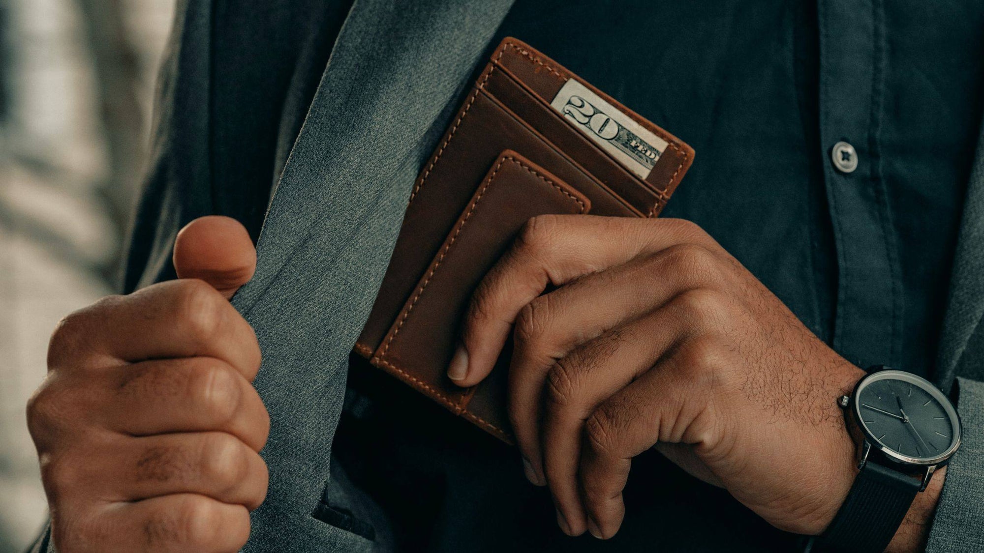 8 Popular Different Types Of Wallets For Men with man putting leather wallet in pocket